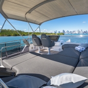 A suite of cushions on a luxury yacht awaiting guests overlooking the pristine Miami skyline
